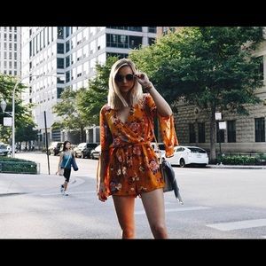 ORANGE PATTERNED LONG-SLEEVE ROMPER